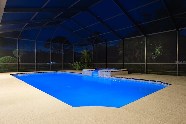 3452 Forelock Rd, Tarpon Springs, FL 34688 - view of swimming pool featuring glass enclosure, a pool with connected hot tub, and a patio area