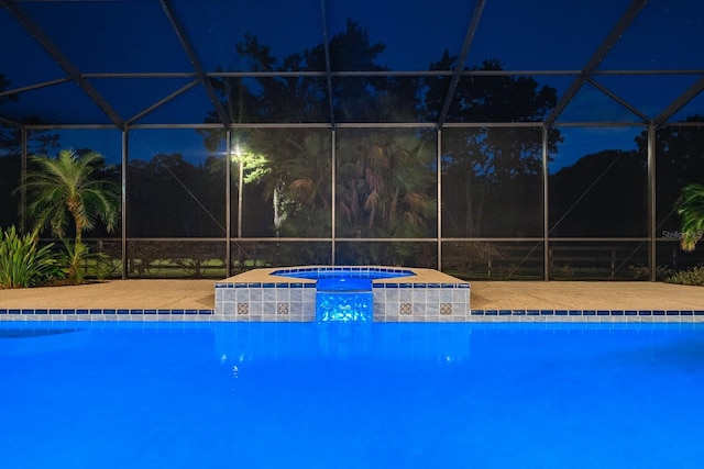 3452 Forelock Rd, Tarpon Springs, FL 34688 - pool at twilight with an in-ground hot tub, a lanai, and an outdoor pool