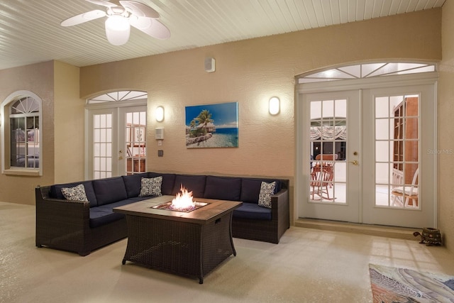 3452 Forelock Rd, Tarpon Springs, FL 34688 - living room with french doors, a textured wall, healthy amount of natural light, and a ceiling fan