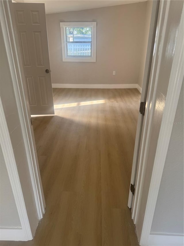 8502 Grapefruit Ave, Tampa, FL 33619 - hallway featuring wood finished floors and baseboards
