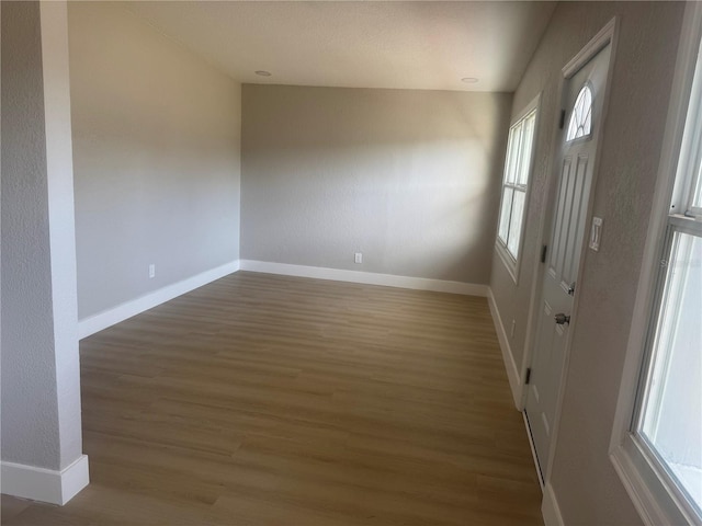 8502 Grapefruit Ave, Tampa, FL 33619 - unfurnished room featuring wood finished floors and baseboards