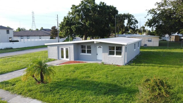 8502 Grapefruit Ave, Tampa, FL 33619 - view of front of property with french doors and stucco siding