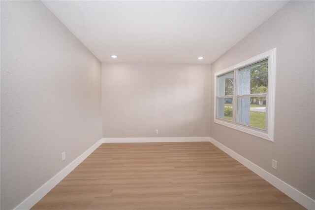 8502 Grapefruit Ave, Tampa, FL 33619 - spare room with light wood finished floors and recessed lighting