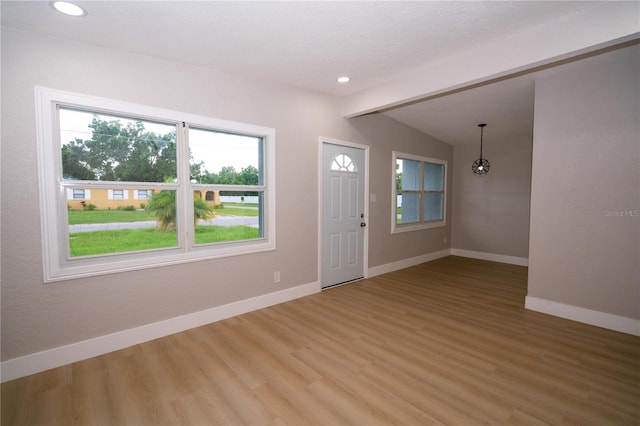 8502 Grapefruit Ave, Tampa, FL 33619 - foyer featuring plenty of natural light, light wood-type flooring, and recessed lighting