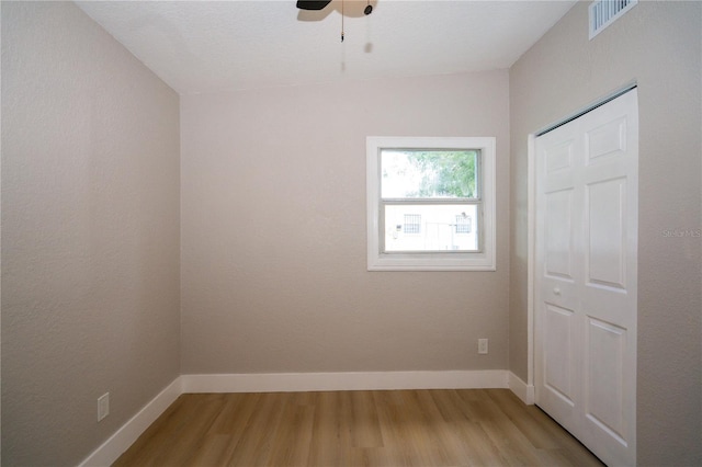 8502 Grapefruit Ave, Tampa, FL 33619 - unfurnished bedroom featuring light wood finished floors and ceiling fan