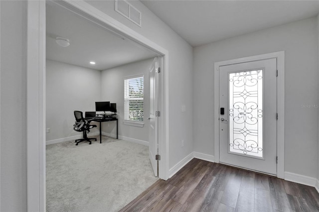 6658 Devlin Ln, Wesley Chapel, FL 33545 - foyer featuring dark wood finished floors and baseboards