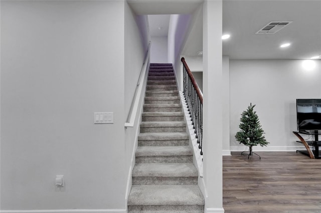 6658 Devlin Ln, Wesley Chapel, FL 33545 - stairway featuring wood finished floors, baseboards, and recessed lighting