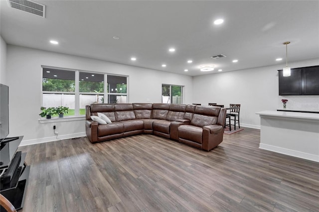 6658 Devlin Ln, Wesley Chapel, FL 33545 - living room featuring dark wood-style floors, recessed lighting, and baseboards