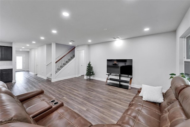6658 Devlin Ln, Wesley Chapel, FL 33545 - living room with wood finished floors, stairway, recessed lighting, and baseboards