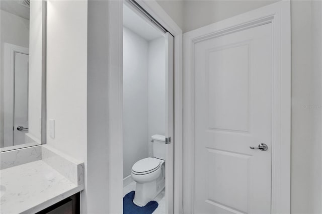6658 Devlin Ln, Wesley Chapel, FL 33545 - bathroom featuring vanity, toilet, and baseboards