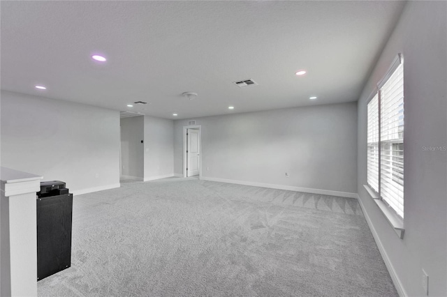 6658 Devlin Ln, Wesley Chapel, FL 33545 - spare room featuring recessed lighting, light colored carpet, and baseboards