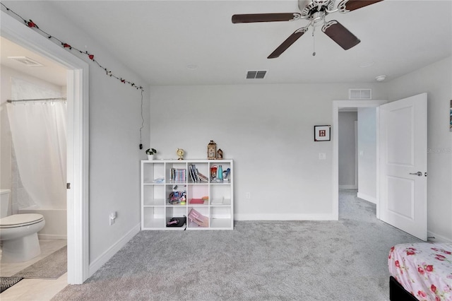 6658 Devlin Ln, Wesley Chapel, FL 33545 - bedroom with carpet, connected bathroom, baseboards, and ceiling fan
