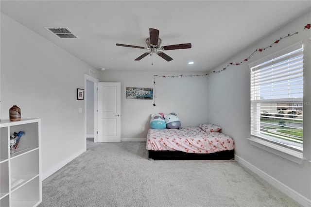 6658 Devlin Ln, Wesley Chapel, FL 33545 - bedroom with carpet floors, baseboards, and ceiling fan