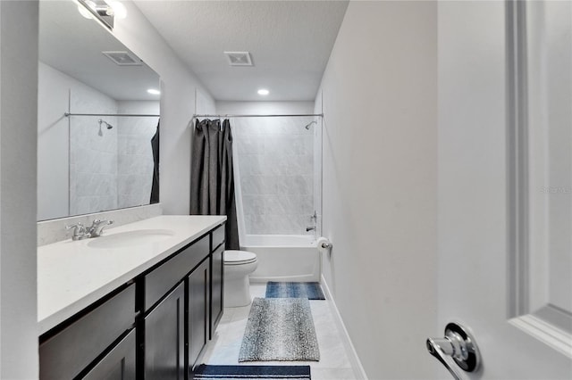 6658 Devlin Ln, Wesley Chapel, FL 33545 - bathroom with toilet, vanity, shower / bath combo with shower curtain, tile patterned flooring, and a textured ceiling