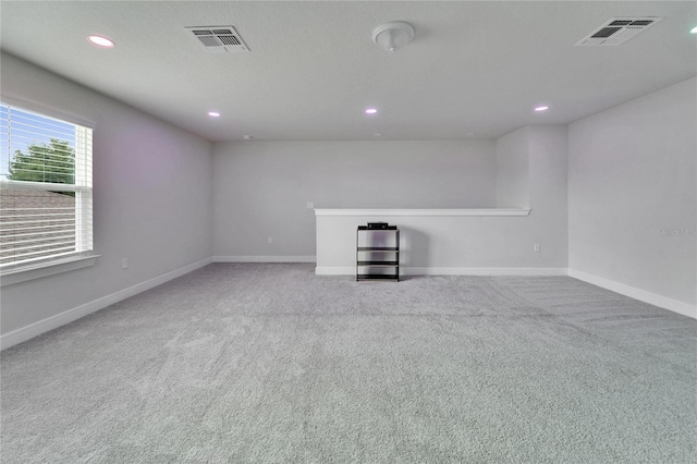 6658 Devlin Ln, Wesley Chapel, FL 33545 - unfurnished living room with carpet, recessed lighting, and baseboards