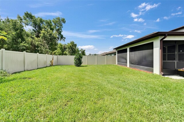 6658 Devlin Ln, Wesley Chapel, FL 33545 - view of yard featuring a sunroom
