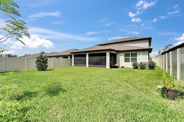 6658 Devlin Ln, Wesley Chapel, FL 33545 - back of house featuring a sunroom and a shingled roof