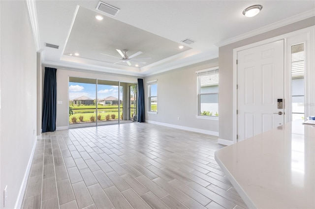 16126 San Donato Pl, Bradenton, FL 34211 - spare room with a raised ceiling, ceiling fan, ornamental molding, wood tiled floors, and recessed lighting