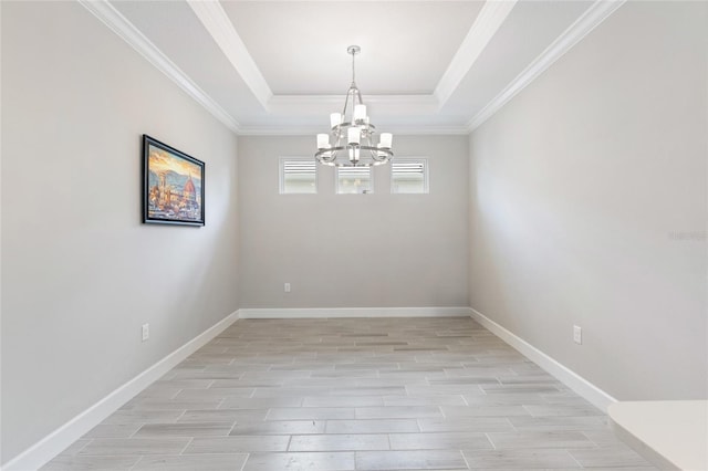 16126 San Donato Pl, Bradenton, FL 34211 - unfurnished room featuring a chandelier, light wood-style floors, a raised ceiling, and ornamental molding