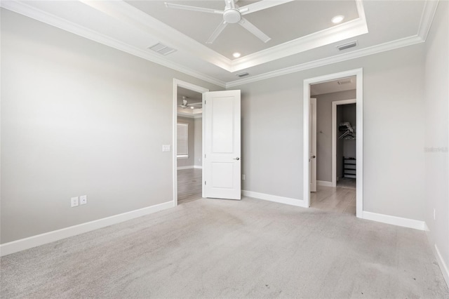 16126 San Donato Pl, Bradenton, FL 34211 - unfurnished bedroom with a raised ceiling, crown molding, light colored carpet, recessed lighting, and ceiling fan