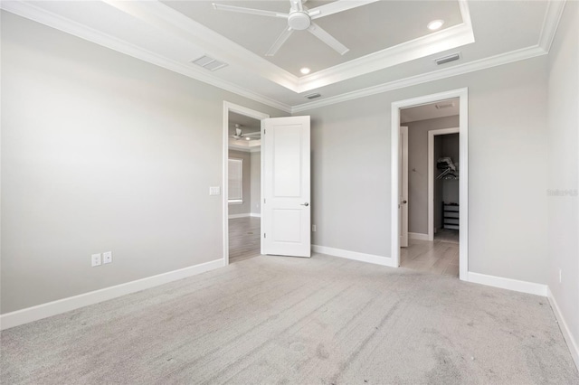 16126 San Donato Pl, Bradenton, FL 34211 - unfurnished bedroom featuring a raised ceiling, ornamental molding, light carpet, recessed lighting, and a ceiling fan