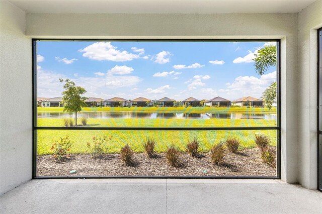 16126 San Donato Pl, Bradenton, FL 34211 - unfurnished sunroom featuring a residential view, plenty of natural light, and a water view