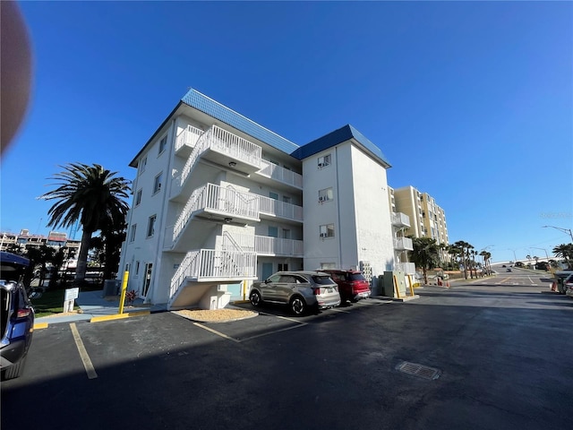 800 Bayway Blvd Unit 14, Clearwater Beach, FL 33767 - view of apartment building / complex featuring uncovered parking