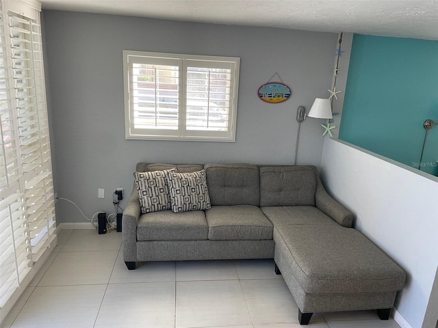 800 Bayway Blvd Unit 14, Clearwater Beach, FL 33767 - living area featuring tile patterned flooring and baseboards