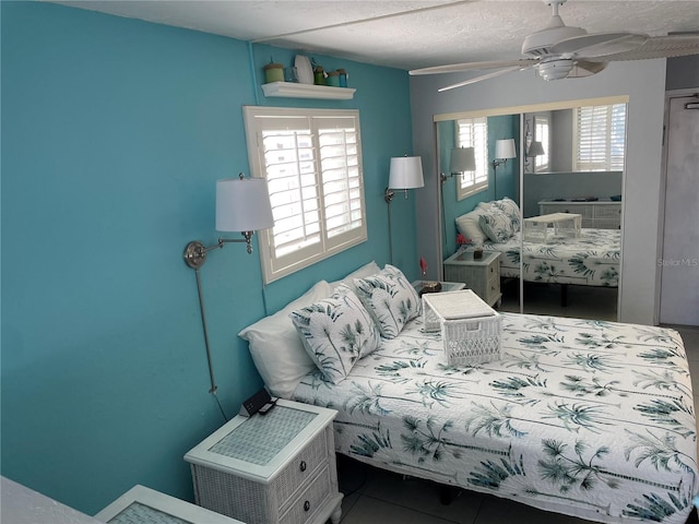 800 Bayway Blvd Unit 14, Clearwater Beach, FL 33767 - bedroom with multiple windows and ceiling fan