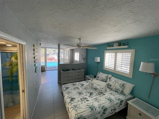 800 Bayway Blvd Unit 14, Clearwater Beach, FL 33767 - tiled bedroom with a ceiling fan