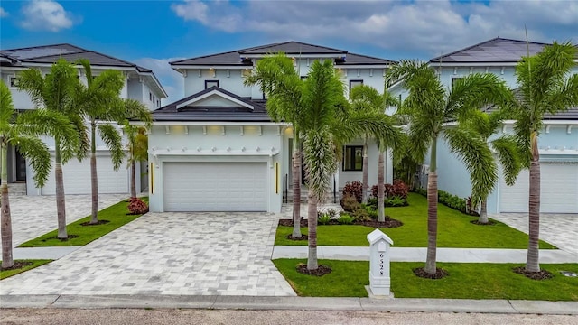 6528 Simone Shores Cir, Apollo Beach, FL 33572 - view of front of property with decorative driveway, a front yard, and stucco siding