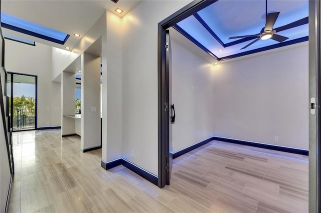 6528 Simone Shores Cir, Apollo Beach, FL 33572 - corridor featuring a skylight, baseboards, light wood-type flooring, and recessed lighting