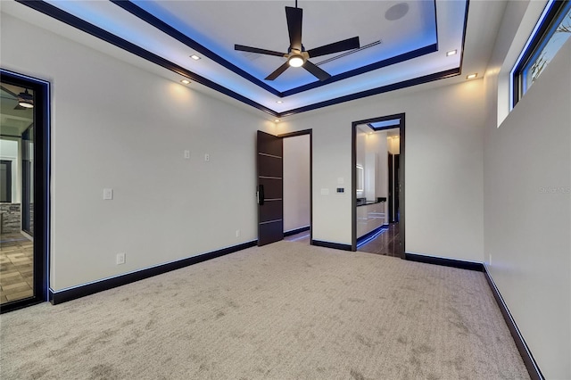 6528 Simone Shores Cir, Apollo Beach, FL 33572 - unfurnished room with a raised ceiling, carpet flooring, ceiling fan, and baseboards