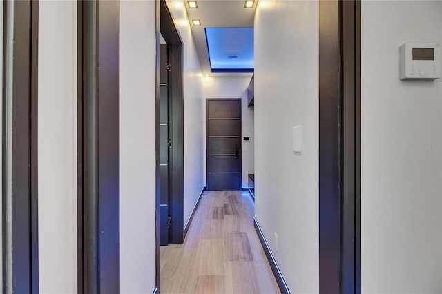 6528 Simone Shores Cir, Apollo Beach, FL 33572 - hallway featuring light wood-type flooring and baseboards