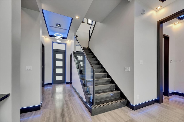 6528 Simone Shores Cir, Apollo Beach, FL 33572 - foyer with stairs, baseboards, and wood finished floors