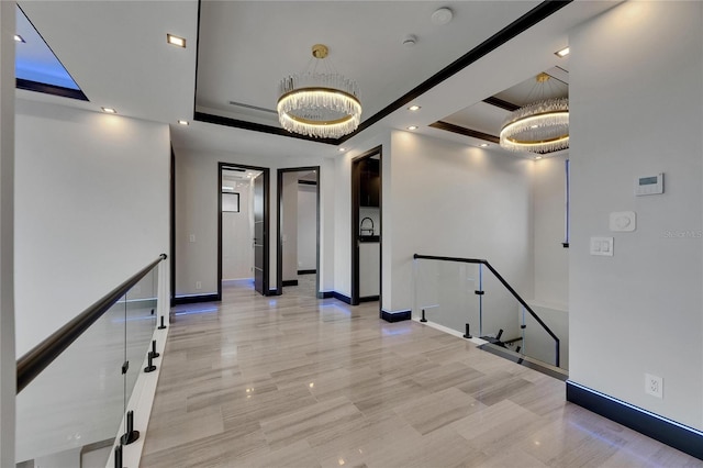 6528 Simone Shores Cir, Apollo Beach, FL 33572 - hall with a chandelier, an upstairs landing, baseboards, a raised ceiling, and recessed lighting