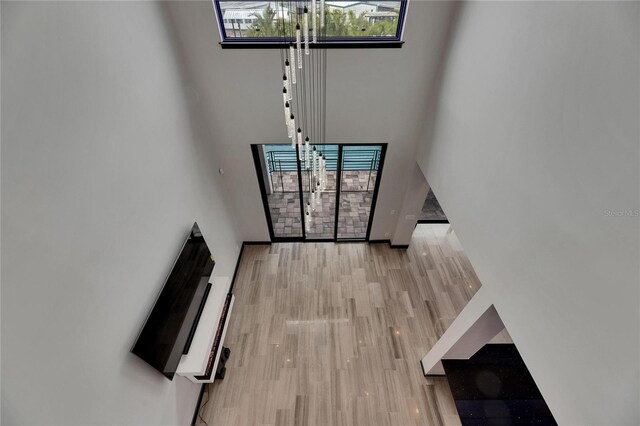 6528 Simone Shores Cir, Apollo Beach, FL 33572 - foyer with a high ceiling and light wood-style flooring