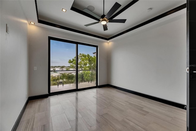 6528 Simone Shores Cir, Apollo Beach, FL 33572 - unfurnished room with a tray ceiling, ceiling fan, and baseboards