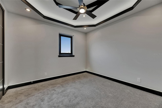 6528 Simone Shores Cir, Apollo Beach, FL 33572 - carpeted spare room with a tray ceiling, a ceiling fan, baseboards, and recessed lighting