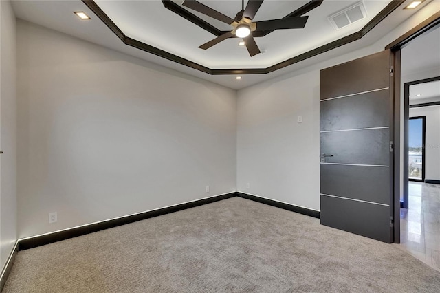 6528 Simone Shores Cir, Apollo Beach, FL 33572 - unfurnished bedroom featuring a tray ceiling, carpet floors, baseboards, and recessed lighting