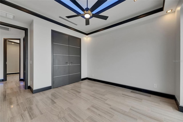 6528 Simone Shores Cir, Apollo Beach, FL 33572 - unfurnished bedroom featuring baseboards and a tray ceiling