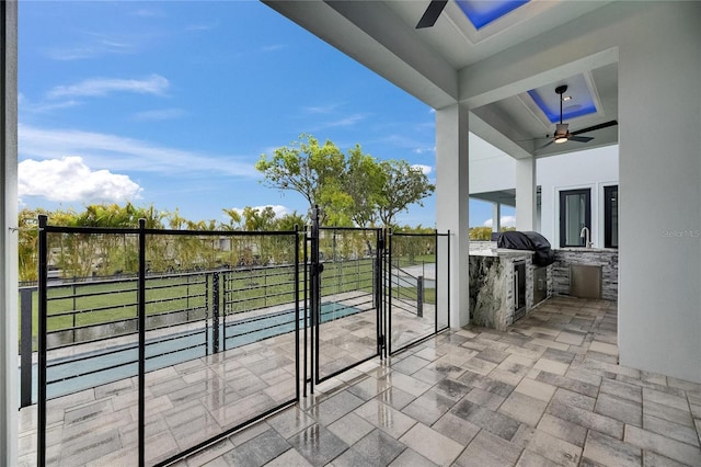6528 Simone Shores Cir, Apollo Beach, FL 33572 - balcony with ceiling fan, area for grilling, and a sink