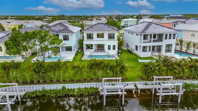 6528 Simone Shores Cir, Apollo Beach, FL 33572 - rear view of house featuring a balcony, a residential view, a water view, and a patio area