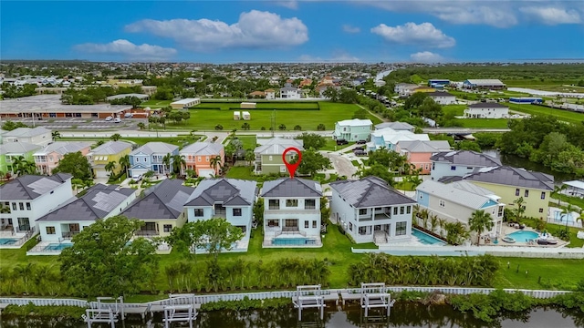 6528 Simone Shores Cir, Apollo Beach, FL 33572 - aerial perspective of suburban area with a pool and a nearby body of water