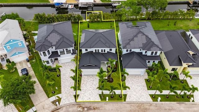 6528 Simone Shores Cir, Apollo Beach, FL 33572 - aerial view of residential area with property boundaries highlighted and a large body of water