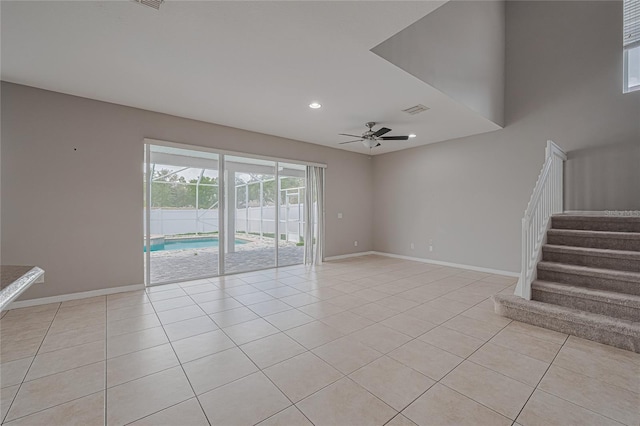 20109 Bay Cedar Ave, Tampa, FL 33647 - unfurnished room with light tile patterned floors, ceiling fan, stairway, baseboards, and recessed lighting