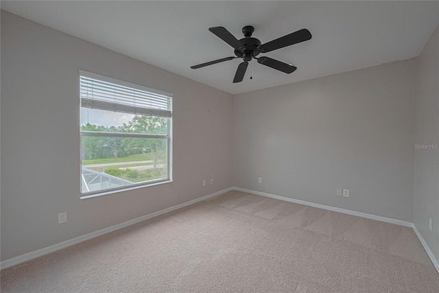 20109 Bay Cedar Ave, Tampa, FL 33647 - spare room with baseboards, light colored carpet, and ceiling fan