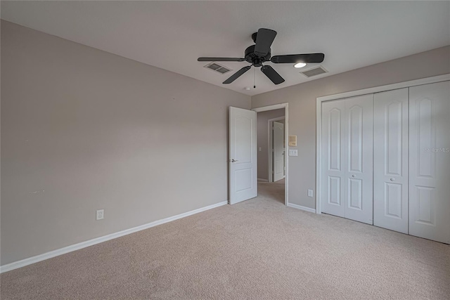20109 Bay Cedar Ave, Tampa, FL 33647 - unfurnished bedroom featuring baseboards, light colored carpet, a closet, and a ceiling fan
