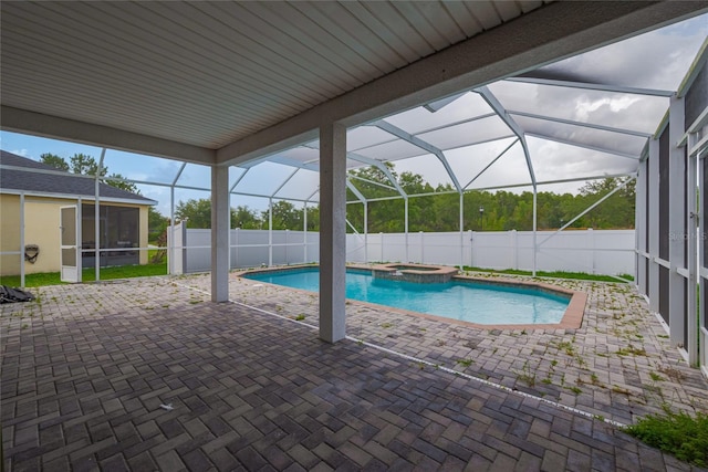 20109 Bay Cedar Ave, Tampa, FL 33647 - view of pool featuring a sunroom, a patio area, and a fenced backyard