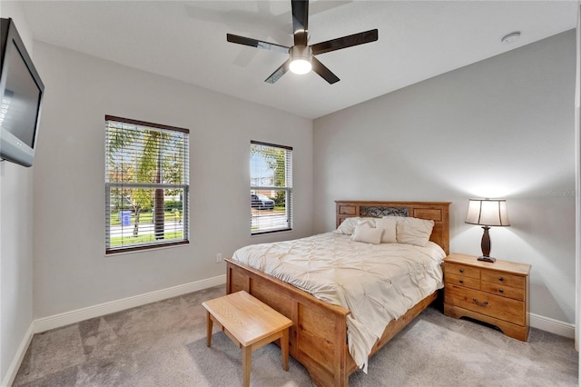 6127 Colmar Pl, Apollo Beach, FL 33572 - bedroom with light carpet, baseboards, and ceiling fan